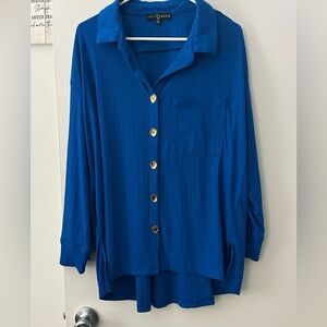 Women’s dress shirt. Longer women’s blue dress shirt with gold buttons.